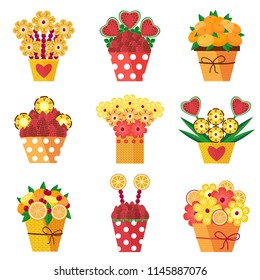 Assorted colorful fruits and berries arranged into a decorative bouquet. Different pots with fruits in bloom carved as flowers. Fresh strawberries, pineapple and heart-shaped watermelon compositions.