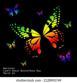 Assorted Farben auf den Flügeln eines fliegenden Schmetterlings einzeln auf schwarzem Hintergrund, National Learn About Butterflies Day, 14. März