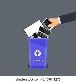 Assorted e-waste trash in special urn. Hand throws trash into the basket. Vector recycle concept. Bin for recycling with sorted garbage and rubbish.