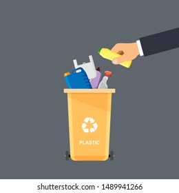 Assorted plastic trash in special urn. Hand throws trash into the basket. Vector recycle concept. Bin for recycling with sorted garbage and rubbish.