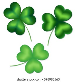 Assortment of clover leaves with shadow on white background. Elements of design for St. patrick's day.
