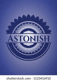 Astonish badge with denim texture. Vector Illustration. Detailed.
