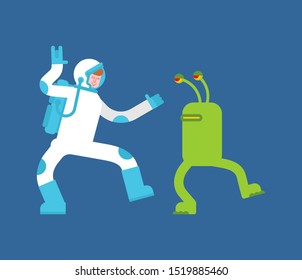 Astronaut and alien dance. Spaceman and Space Invader dancer. Space disco
