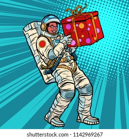 Astronaut birthday with a gift. African American people. Pop art retro vector illustration kitsch vintage drawing