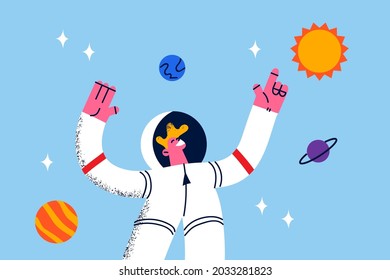 Astronaut during work in space concept. Young smiling cosmonaut in white protective suit standing levitating in space near planets and galaxies around vector illustration 