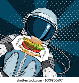 Astronaut with fast food hamburger in pop art style. Cosmonaut on blue background eating cheeseburger