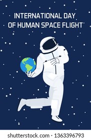 An Astronaut flying in space playing Earth like in basketball. Greeting card on human space flight international day