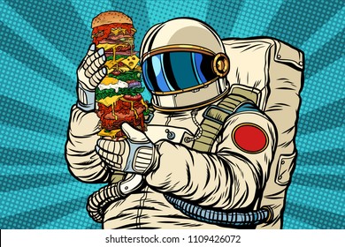 Astronaut with a giant burger. Pop art retro vector illustration kitsch vintage drawing