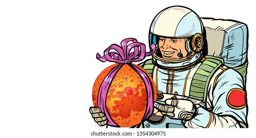 Astronaut gives the planet Mars. Isolate on white background. Pop art retro vector illustration drawing kitsch vintage