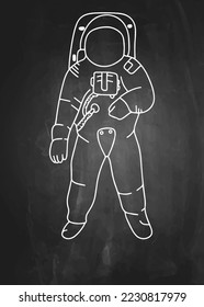 An astronaut hand drawn with chalk on a blackboard. Isolated vector graphic.
