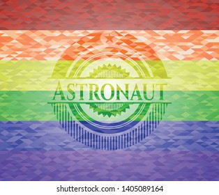 Astronaut on mosaic background with the colors of the LGBT flag