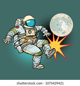 Astronaut plays football with the Moon. Pop art retro vector illustration cartoon comics kitsch drawing