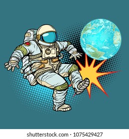 Astronaut plays planet Earth football. Pop art retro vector illustration cartoon comics kitsch drawing