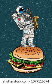 Astronaut plays saxophone on a Burger. Pop art retro vector illustration comic cartoon kitsch drawing