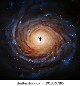 Astronaut in space. Cosmonaut silhouette. Spiral galaxy. Elements of this image furnished by NASA