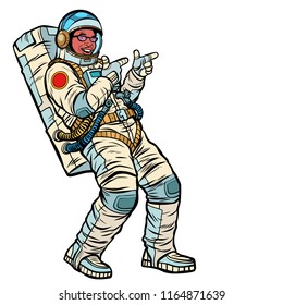 Astronaut young man points. isolate on a white background. African American people. Pop art retro vector illustration kitsch vintage drawing