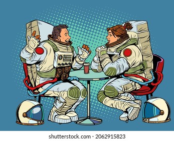 Astronauts man and woman couple date in a cafe. Meeting two friends