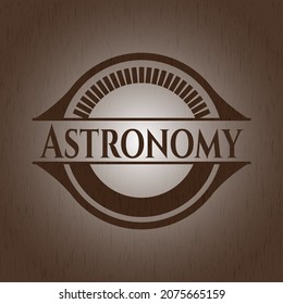 Astronomy badge with wooden background. 