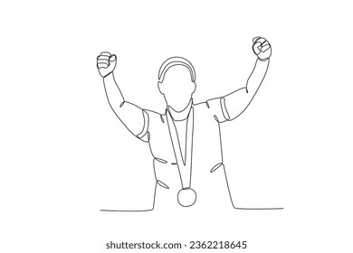An athlete clenches his fist with a medal around his neck. Spain's women's football team victory