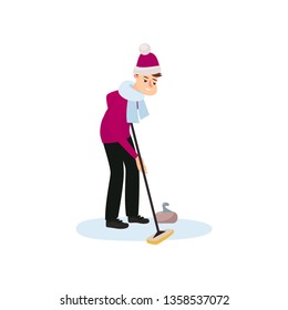 An athlete in a red hat and scarf on the ice is rubbing the floor with a brush, thus pushing a stone.