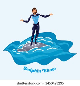 Athletic man standing rides a dolphin swimming in the water