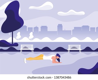 athletic woman doing push-ups in the park