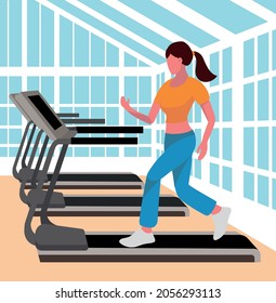 
athletic woman running on a treadmill in a gym