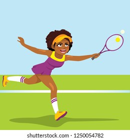 Athletic young African American professional tennis woman player running in tennis court