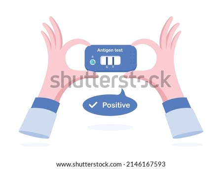 ATK covid-19 test result positive. Hand hold Antigen test kit.
