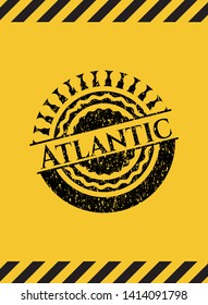 Atlantic black grunge emblem, yellow warning sign. Vector Illustration. Detailed.