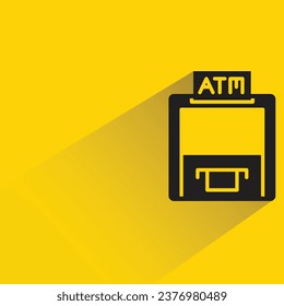 atm with shadow on yellow background