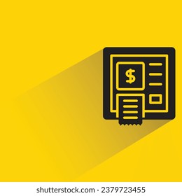 atm with shadow on yellow background