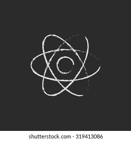 Atom hand drawn in chalk on a blackboard vector white icon isolated on a black background.