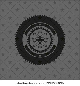 atom icon inside black emblem