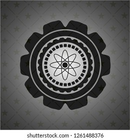 atom icon inside black emblem