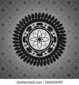 atom icon inside black emblem