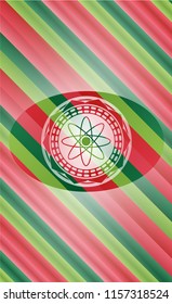 atom icon inside christmas badge background.