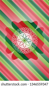 atom icon inside christmas colors emblem.