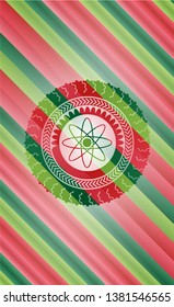 atom icon inside christmas colors style badge.
