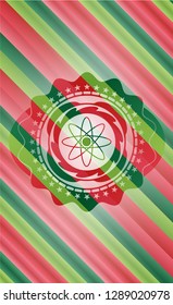 atom icon inside christmas emblem.