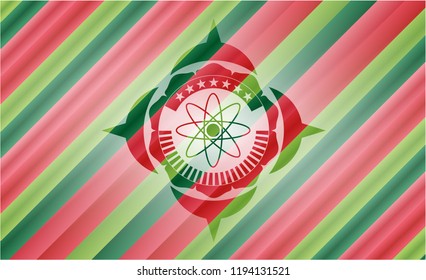 atom icon inside christmas style emblem.