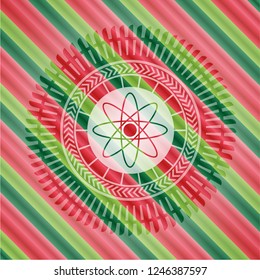 atom icon inside christmas style emblem.