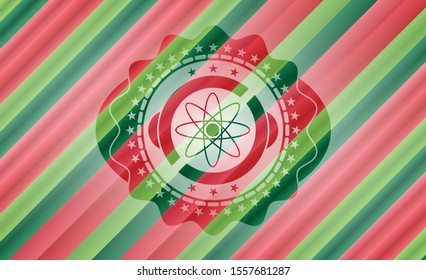 atom icon inside christmas style badge..