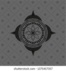 atom icon inside dark badge or emblem