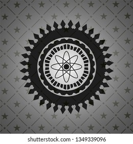atom icon inside dark emblem