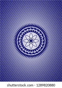 atom icon inside emblem with denim high quality background