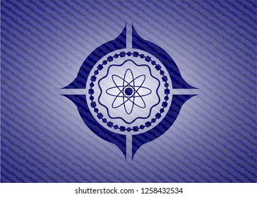 atom icon inside emblem with jean high quality background