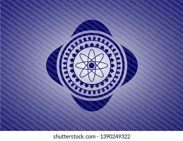 atom icon inside emblem with jean high quality background