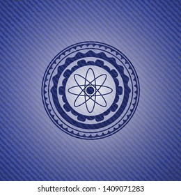 atom icon inside emblem with jean texture
