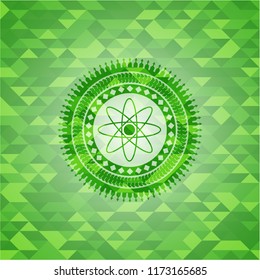 atom icon inside green emblem. Mosaic background